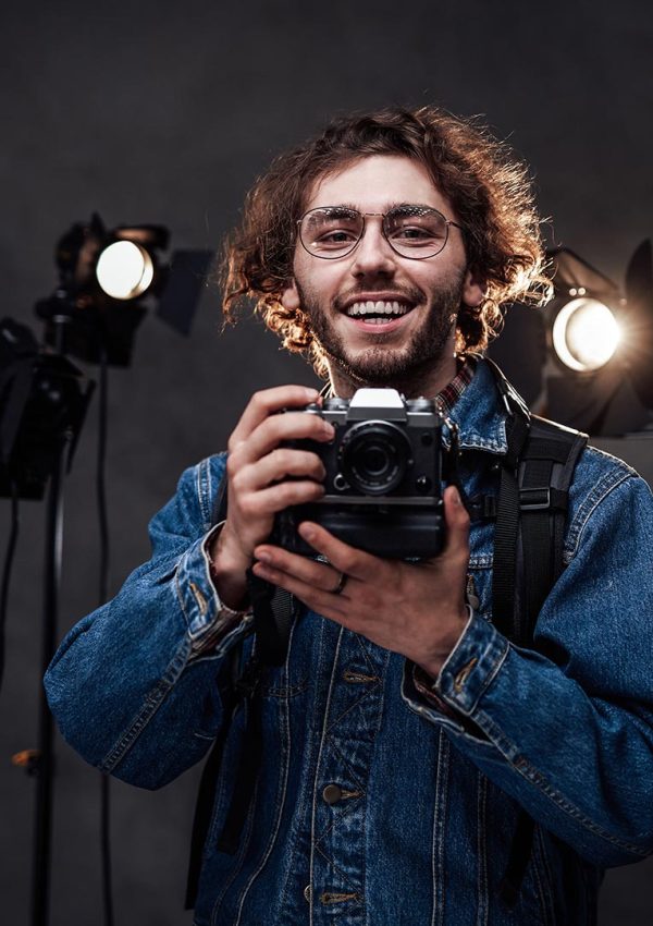 young-photographer-holds-a-camera-studio-portrait-resize.jpg young-photographer-holds-a-camera-studio-portrait-resize.jpg
